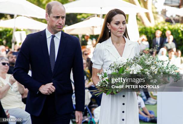 Britain's Prince William, Duke of Cambridge and Britain's Catherine, Duchess of Cambridge lay a wreath at a memorial service at the foot of Grenfell...