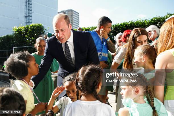 Prince William, Duke of Cambridge and Catherine, Duchess of Cambridge speak with survivors and bereaved children during a memorial service to mark...