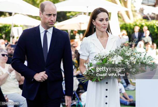 Prince William, Duke of Cambridge and Catherine, Duchess of Cambridge carry a wreath to lay it during a memorial service to mark the fifth...