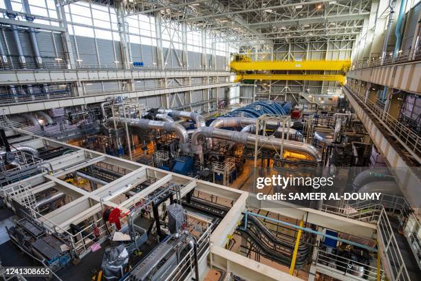 Picture shows the turbine deck in the third-generation European Pressurised Reactor project nuclear reactor of Flamanville, Normandy on June 14,...