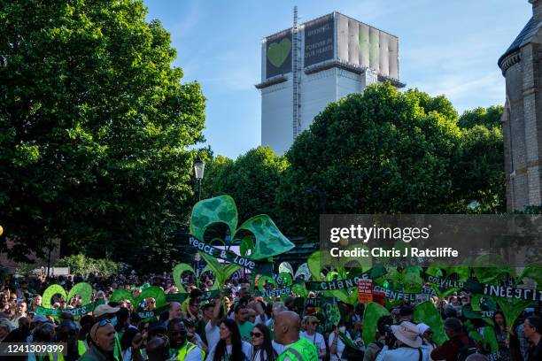 Members of the local community take part in a silent walk to remember five years since the Grenfell Tower fire on June 14, 2022 in London, England....