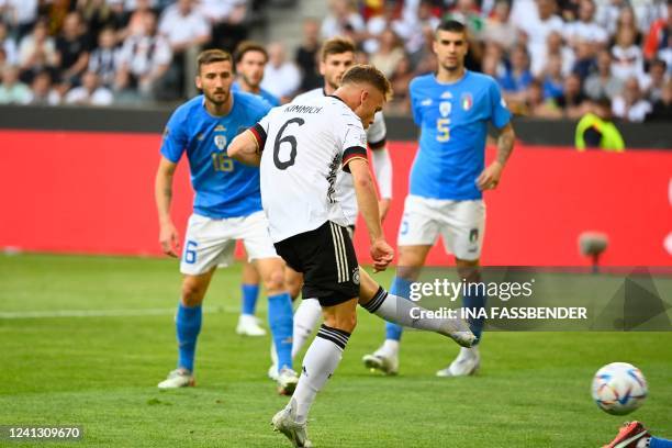 Germany's midfielder Joshua Kimmich scores the opening goal during the UEFA Nations League football match Germany v Italy at the Borussia Park...