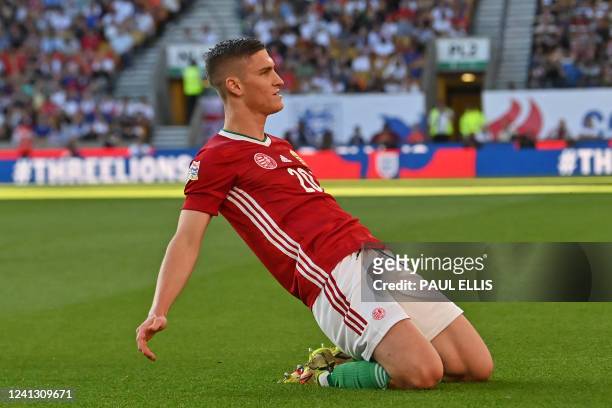 Hungary's midfielder Roland Salai celebrates after scoring the opening goal of the UEFA Nations League, league A group 3 football match between...