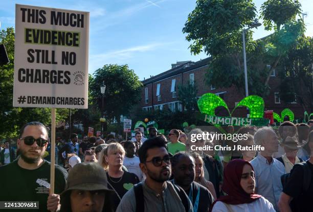 Members of the local community take part in a silent walk to remember five years since the Grenfell Tower fire on June 14, 2022 in London, England....