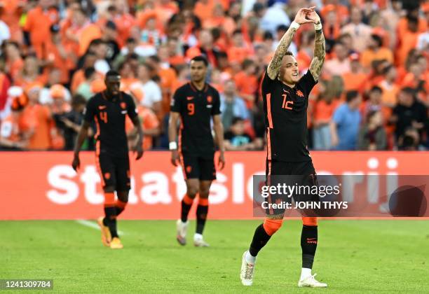 Netherlands' forward Noa Lang celebrates scoring his team's first goal during the UEFA Nations League - League A Group 4 football match between...