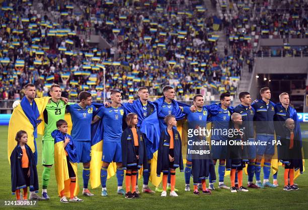Ukraine captain Andriy Yarmolenko and team-mates during the national anthems before the UEFA Nations League match at the Stadion Miejski im...