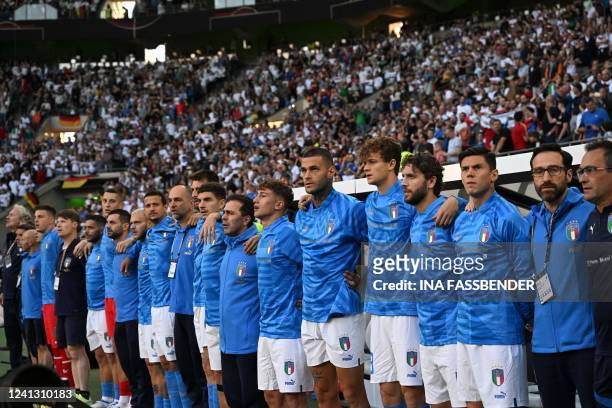 Italy's players line up as they sing their national anthem prior to the UEFA Nations League football match Germany v Italy at the Borussia Park...