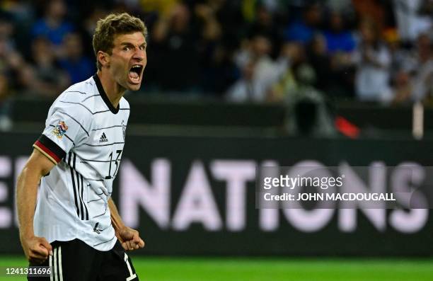 Germany's forward Thomas Mueller celebrates scoring the 3-0 goal during the UEFA Nations League football match Germany v Italy at the Borussia Park...