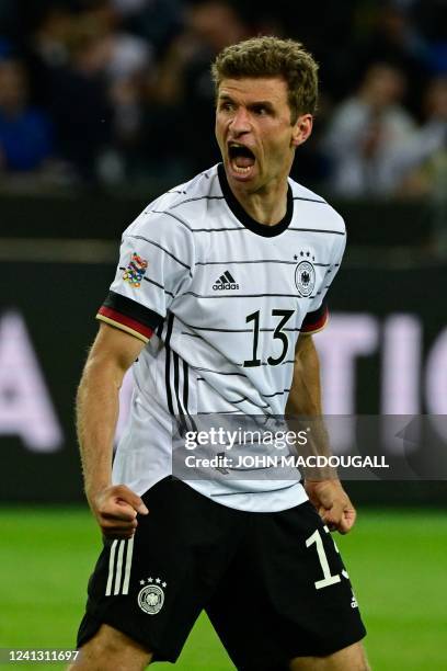 Germany's forward Thomas Mueller celebrates scoring the 3-0 goal during the UEFA Nations League football match Germany v Italy at the Borussia Park...