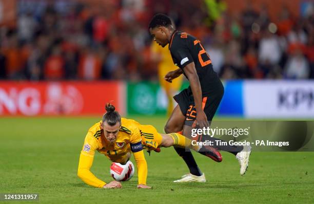 Netherlands Denzel Dumfries and Wales Gareth Bale battle for the ball during the UEFA Nations League match at the Stadion Feijenoord, Rotterdam....