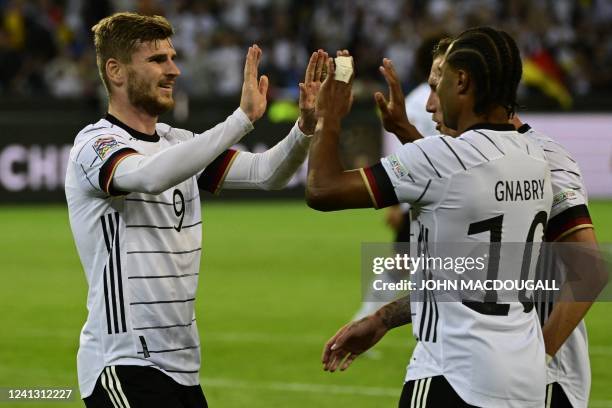 Germany's forward Timo Werner celebrates scoring the 4-0 goal with his teammates during the UEFA Nations League football match Germany v Italy at the...