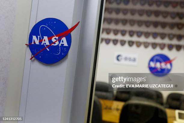 Logos are seen in the conference room of the Astronaut Crew Quarters at Kennedy Space Center, in Cape Canaveral, Florida, on June 14, 2022. NASA's...