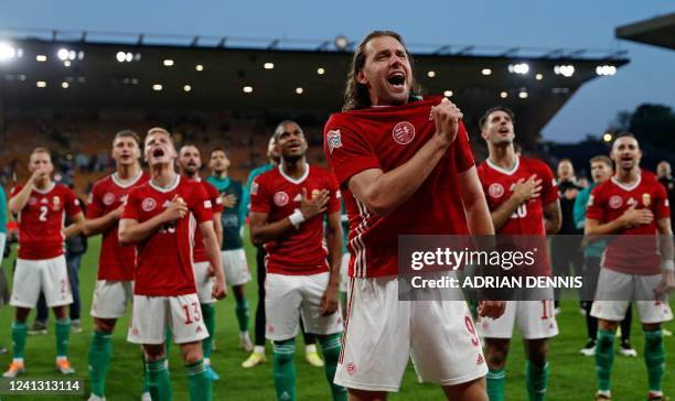 Hungary's striker Adam Szalai leads the celebrations as Hungary's players celebrate in front of their supporters after the UEFA Nations League,...