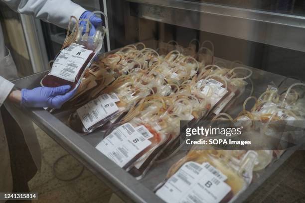Red cross worker checks on blood plasma samples at a red cross blood bank in San Salvador. Every June 14, world blood day is celebrated to advocate...