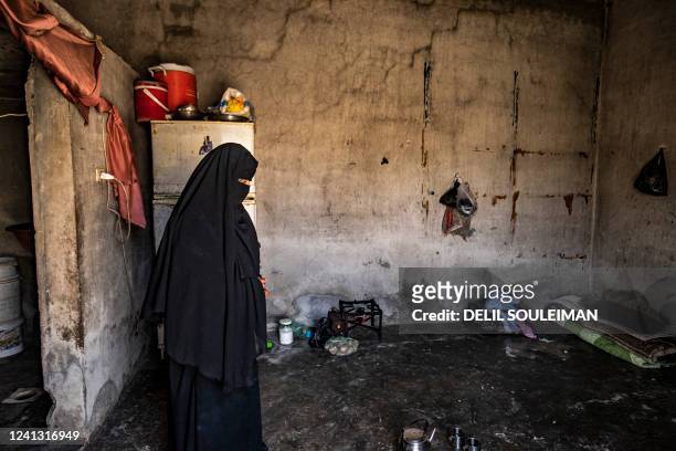 Nora a former detainee at the Kurdish-run al-Hol camp where relatives of suspected Islamic State group fighters were held, gives an interview at her...