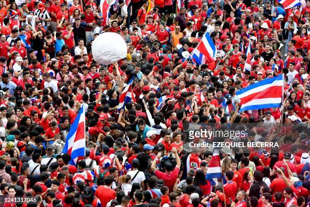 Costa Rican football fans celebrate in the streets of San Jose the qualification of the national football team for this year's FIFA World Cup Qatar...