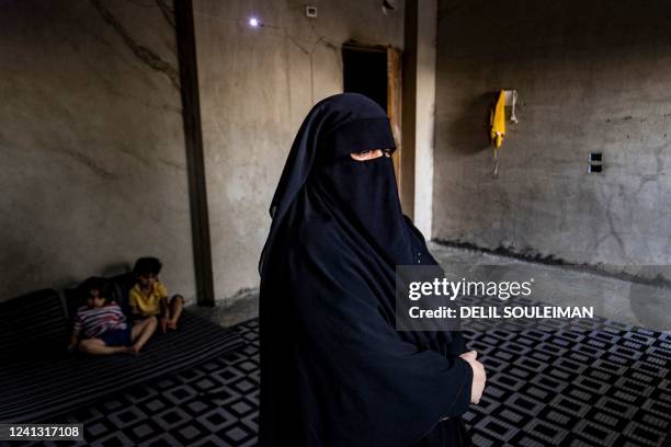 Amal a former detainee at the Kurdish-run al-Hol camp where relatives of suspected Islamic State group fighters were held, gives an interview at her...