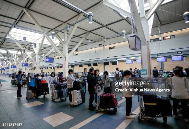 Travelers line up at Vancouver International Airport in Richmond, British Columbia, Canada, on June 14, 2022. The Canadian federal government...
