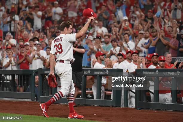 Miles Mikolas of the St. Louis Cardinals acknowledges fans after being pulled in the ninth inning against the Pittsburgh Pirates during the second...