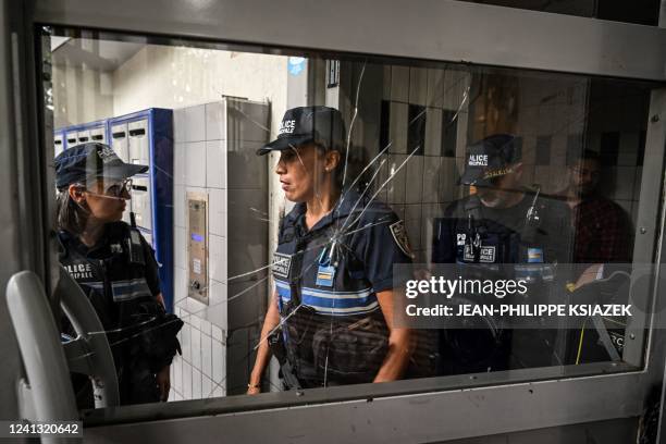 Municipal police officers patrol in La Duchere district on June 15 in Lyon, central-eastern France, where two people were killed and two others...