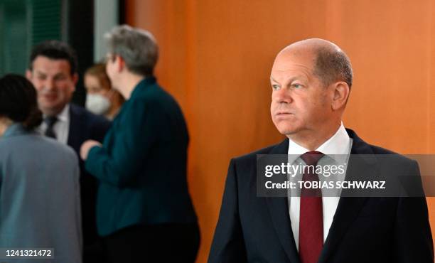 German Chancellor Olaf Scholz reacts as he arrives to attend the weekly cabinet meeting at the Chancellery in Berlin on June 15, 2022.