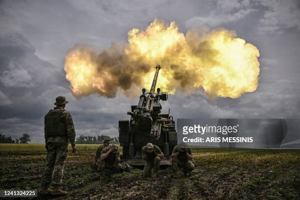 Ukrainian servicemen fire with a French self-propelled 155 mm/52-calibre gun Caesar towards Russian positions at a front line in the eastern...