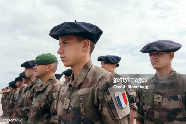 French Army soldiers deployed to Romania stand to attention during a visit by France's President Emmanuel Macron to NATO forces at the Mihail...