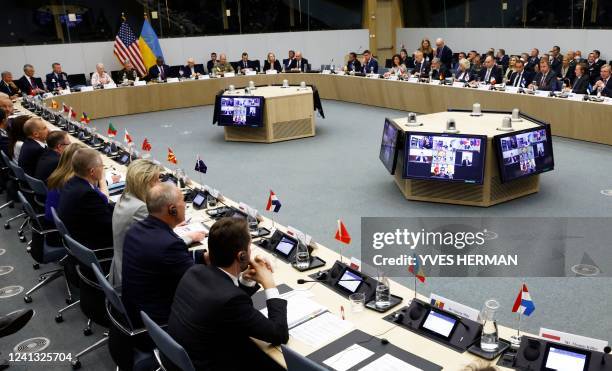 Officials attend the Ukraine Defence Contact group meeting ahead of a NATO defence ministers' meeting at the alliance's headquarters in Brussels,...