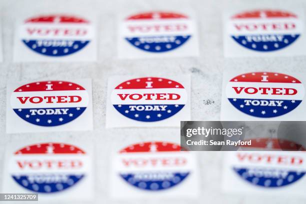 Stickers reading I voted today sit on a table at a polling location during midterm primary elections on June 14, 2022 in Summerville, South Carolina....