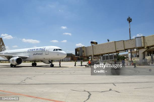 Cham Wings Airlines Airbus A320-211 is pictured at the Syria's Aleppo airport after flights were diverted from Damascus aiport following an Israeli...