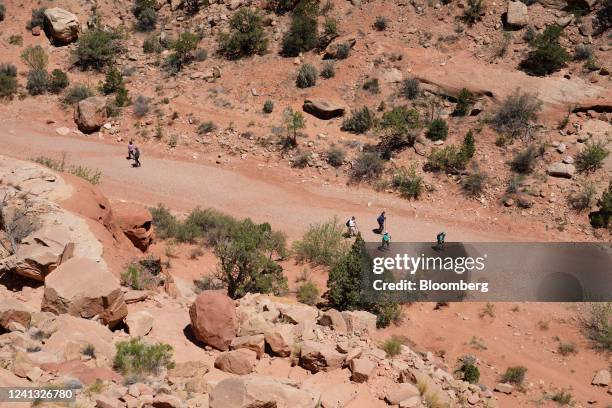 Hikers walk up Grand Wash at Capitol Reef National Park outside of Torrey, Utah, US, on Tuesday, June 14, 2022. Record high temperatures continue to...