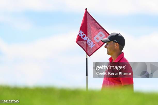 Jordan Spieth smiles next to the pin flag on the eighth hole during practice for the U.S. Open at The Country Club on June 14, 2022 in Brookline,...
