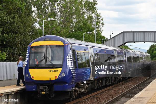 ScotRail train sits at a station, as the company announces it will have to cut 90% of its services on some days next week if the planned strike...