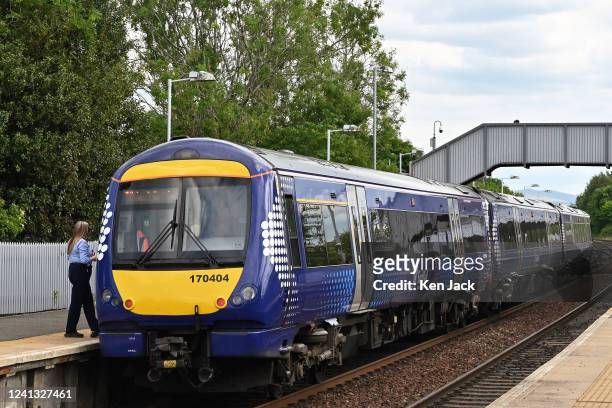ScotRail train sits at a station, as the company announces it will have to cut 90% of its services on some days next week if the planned strike...