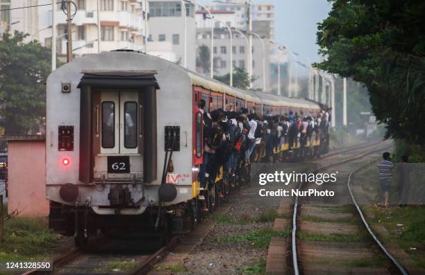 Passengers travel on a crowded train in Colombo on June 15, 2022.