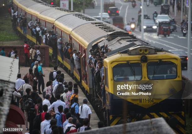 Passengers travel on a crowded train in Colombo on June 15, 2022.
