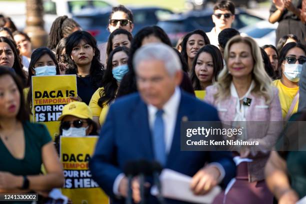 Activists and attendees listen as Sen. Bob Menendez speaks during a news conference marking the 10th anniversary of the passing of Deferred Action...