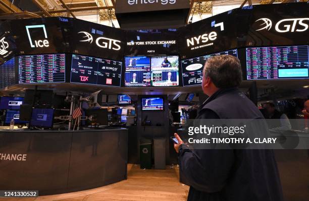 Traders work on the floor of the New York Stock Exchange June 15, 2022 in New York as the US Federal Reserve announces a hike in interest rates. -...