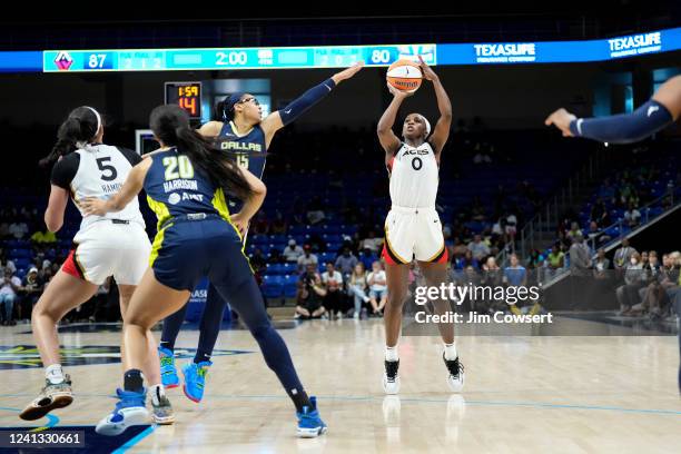 Jackie Young of the Las Vegas Aces shoots a three point basket during the game against the Dallas Wings on June 15, 2022 at the College Park Center...
