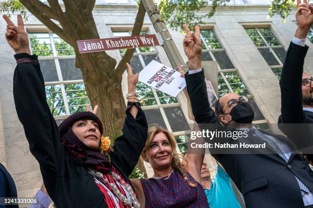 Human rights activists celebrate during an event to rename the street outside the outside the Embassy of the Kingdom of Saudi Arabia to Jamal...