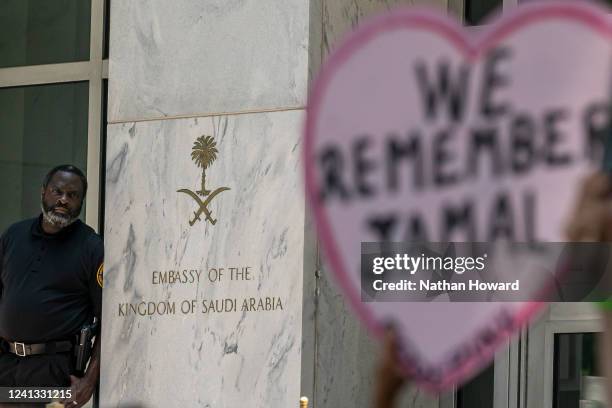 Security watches an event celebrating the renaming of the street outside the Embassy of the Kingdom of Saudi Arabia to Jamal Khashoggi Way on June...