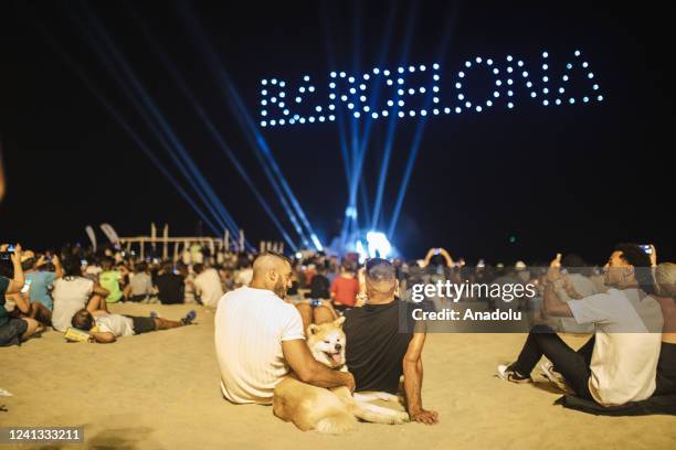 People gather at Somorrostro beach to watch drone show during ISEA 2022 in Barcelona, Spain on June 16, 2022. Somorrostro beach hosts the first light...