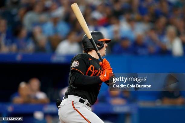 Adley Rutschman of the Baltimore Orioles hits a double in the seventh inning against the Toronto Blue Jays at Rogers Centre on June 15, 2022 in...