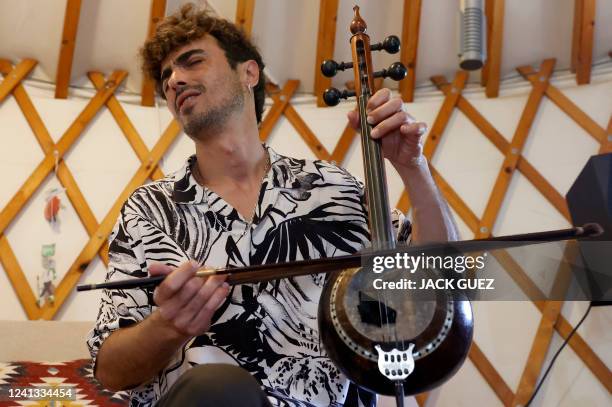 Israeli musician Mark Eliyahu plays the "kamanci" bowed string instrument, in his yurt in the northern moshav of Beitt Zaid in northern Israel on...