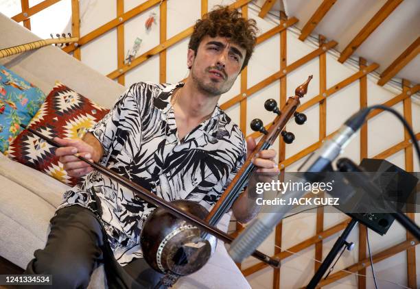 Israeli musician Mark Eliyahu plays the "kamanci" bowed string instrument in his yurt in the northern moshav of Beitt Zaid in northern Israel on...