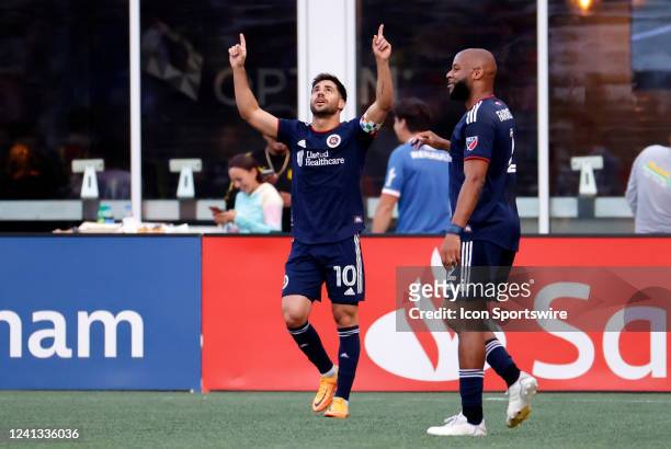 New England Revolution forward Carles Gil salutes his goal during a match between the New England Revolution and Orlando City SC on June 15 at...