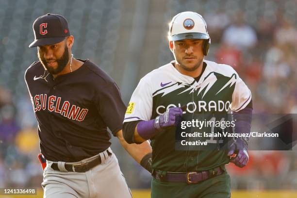 Amed Rosario of the Cleveland Guardians tags Jose Iglesias of the Colorado Rockies at Coors Field on June 15, 2022 in Denver, Colorado.