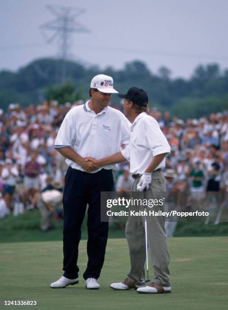 Mark Brooks of the United States is congratulated by Kenny Perry of the United States after defeating him in a play-off for the United States PGA...