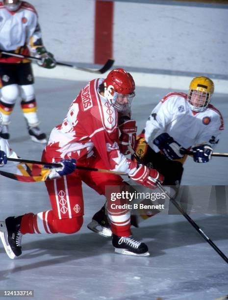 Eric Lindros of Team Canada skates with the puck during a 1992 World Junior Championships game against Germany on December 26, 1991 in Fussen,...