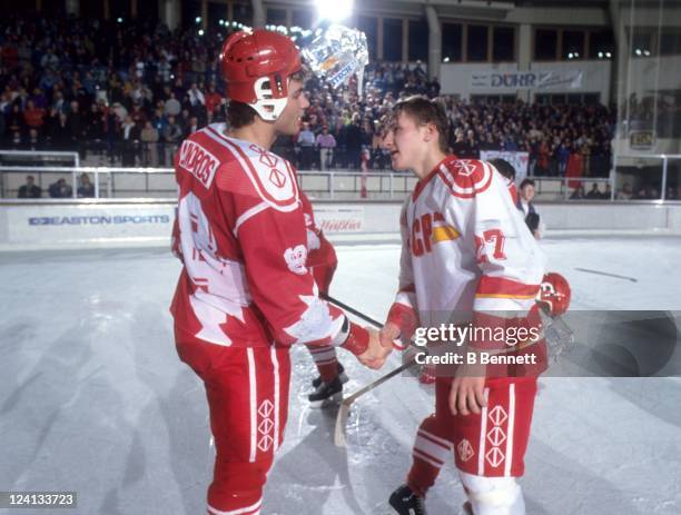 Eric Lindros of Team Canada shakes hands with Alexei Kovalev of the Commonwealth of Independent States after the 1992 World Junior Championships...